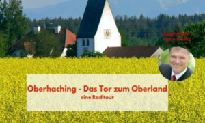 Blick auf die St. Stefans Kirche hinter einem gelben Rapsfeld mit dem Titel „Oberhaching – das Tor zum Oberland“.